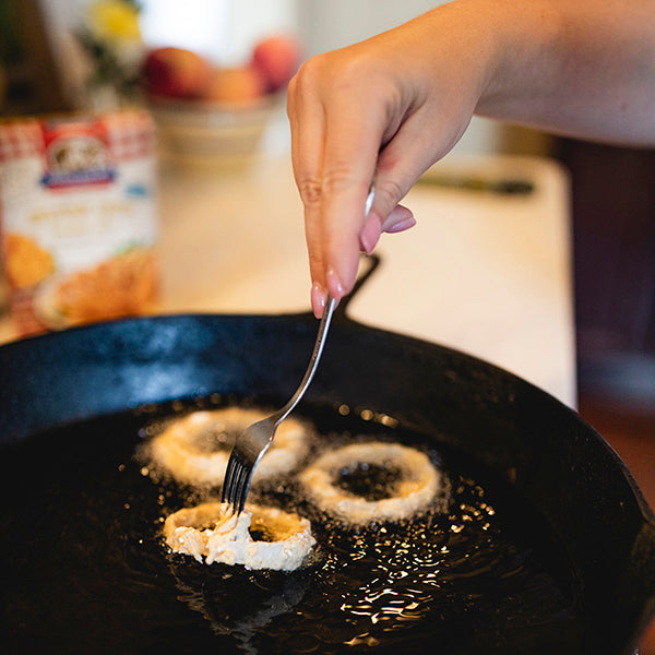 
            
                Load image into Gallery viewer, Frying Awesome Onion rings in oil in a skillet
            
        