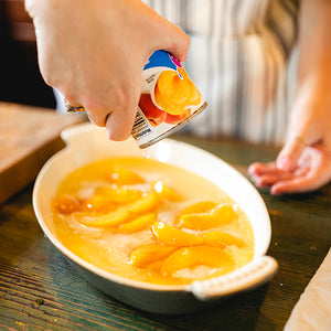 Preparing Peach Cobbler Dessert